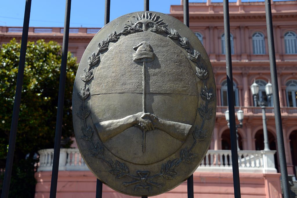 02 The Coat Of Arms Of Argentina The Sun Overlooking Two Hands Shaking Casa Rosado Plaza de Mayo Buenos Aires